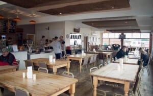 The inside of Eat Inn Diner' restaurant in Colchester, with a view of the restaurant's tables and counter