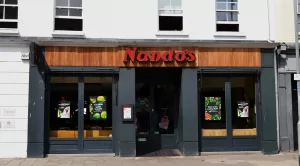The front of 'Nando's' restaurant in Colchester, with a view of the restaurant's window display